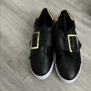 Women "QUIPID" Blk with gold trim slip on/lace up sneakers.